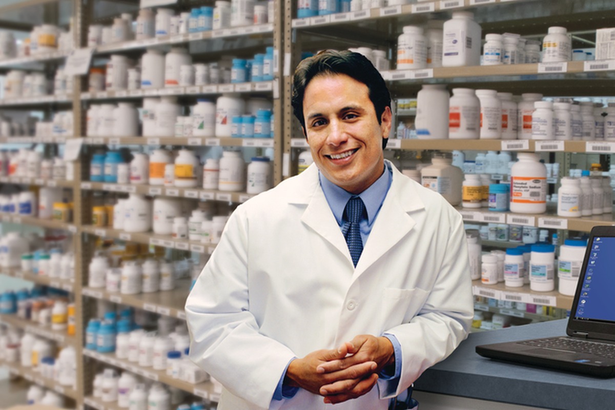 A health-system pharmacist at the dispensing counter