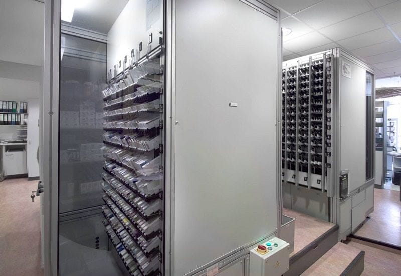 Two RoboPharma package dispensing robots running in parallel